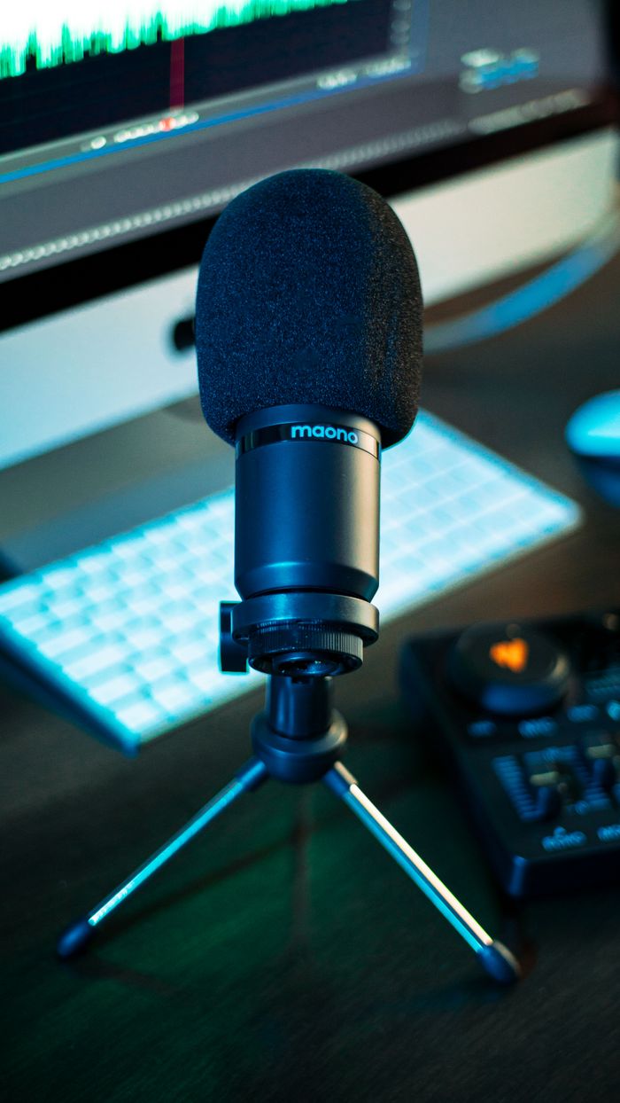 Close-up of a microphone setup for recording in a professional studio environment.
